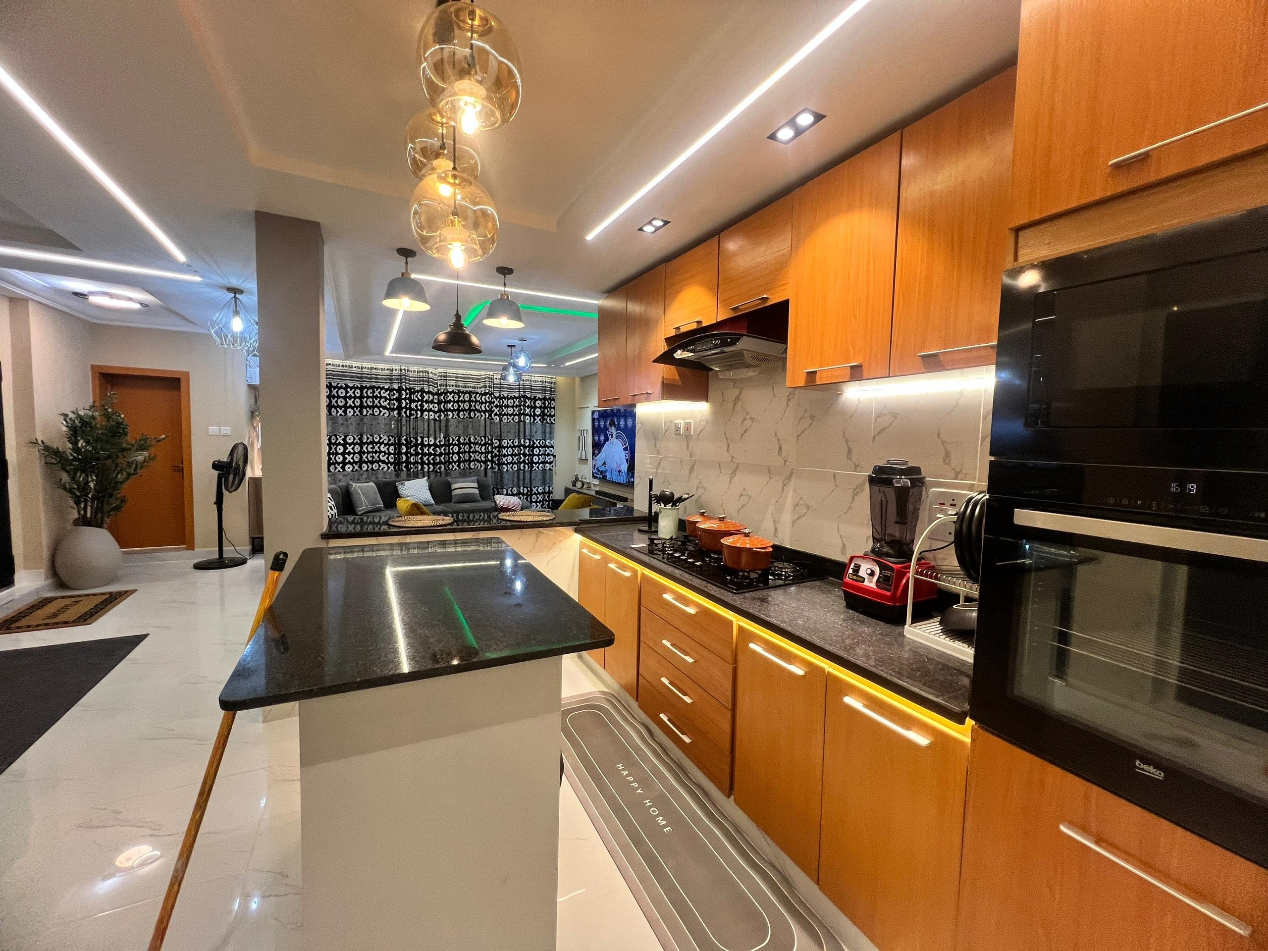 2-bedroom service apartment in Surulere Lagos with furnished living room, dining area, and modern kitchen.