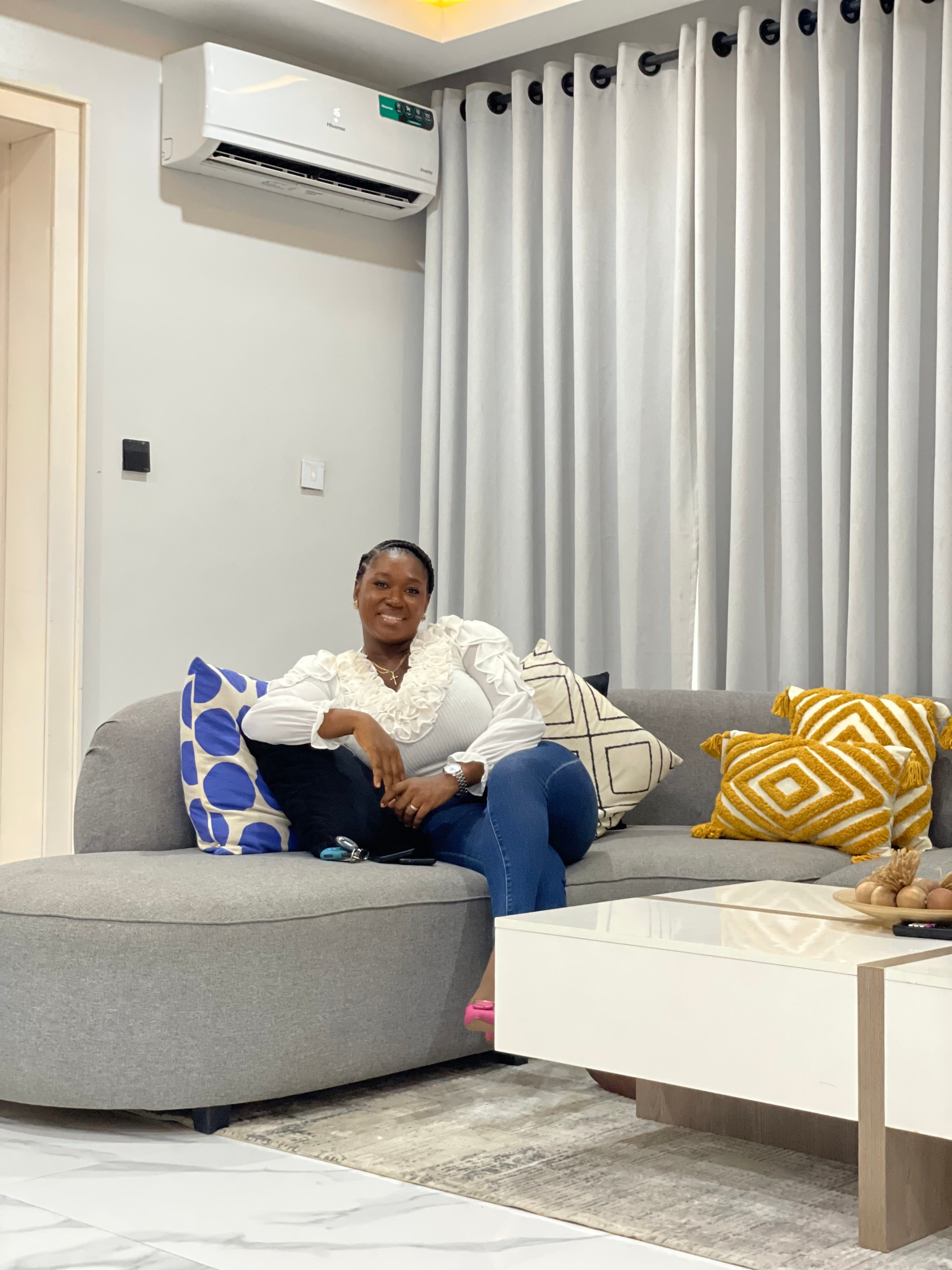 Happy guest checking into a well-furnished service apartment